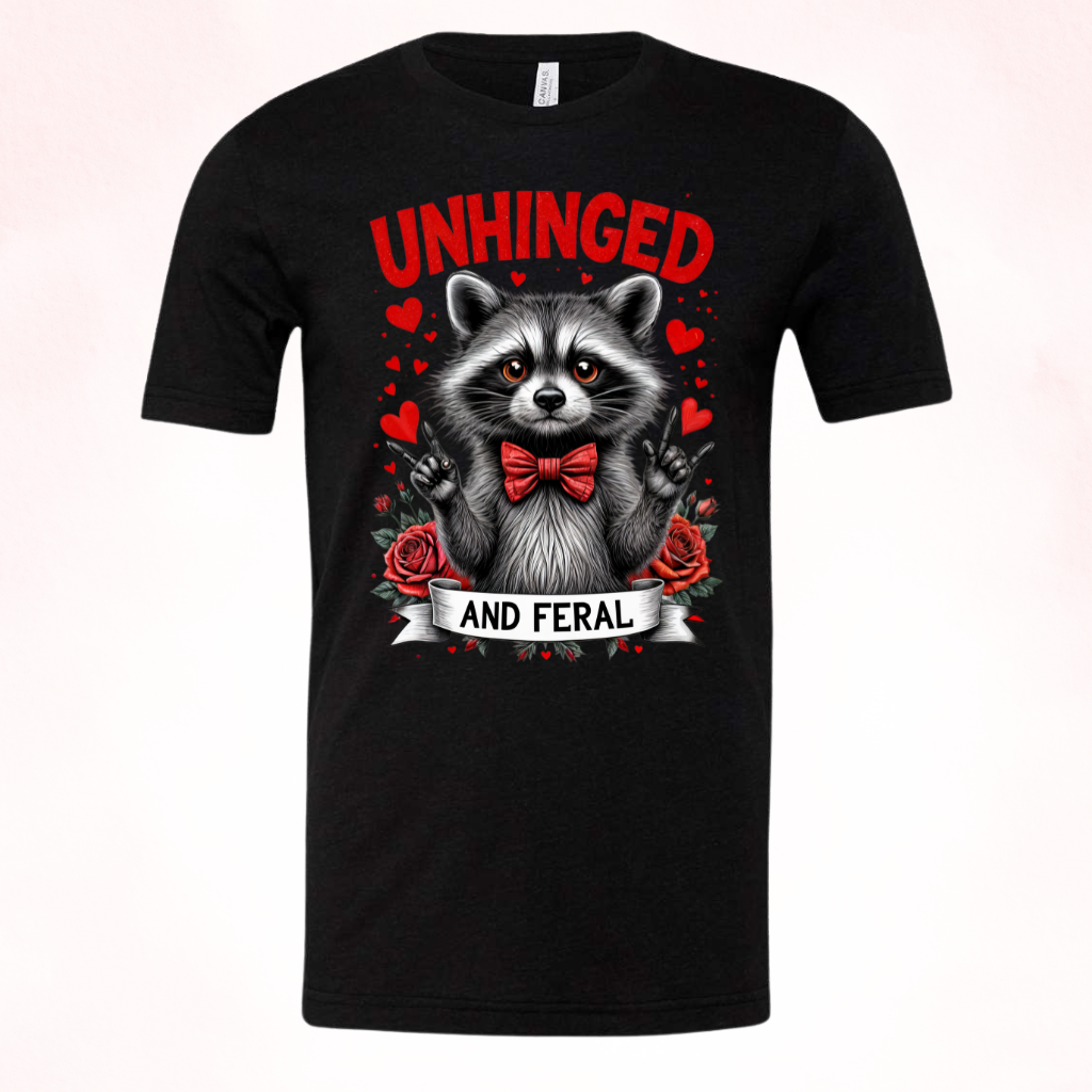 Farel Raccoon Valentine's Day Shirt in black with raccoon design and "Unhinged and Feral" text.